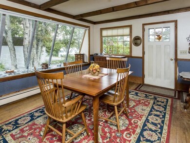 The dining room with closet and wood...
