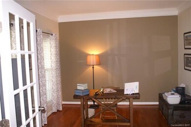 Study with double doors, hardwood floors and beaut