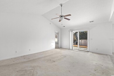 Unfurnished room with high vaulted ceiling, light 
