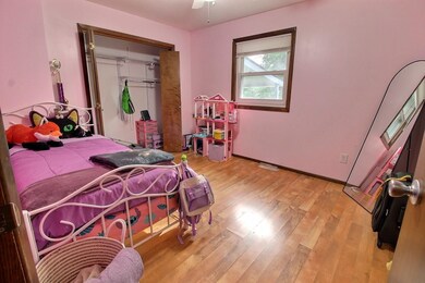Bedroom featuring a closet and light wood-style flooring