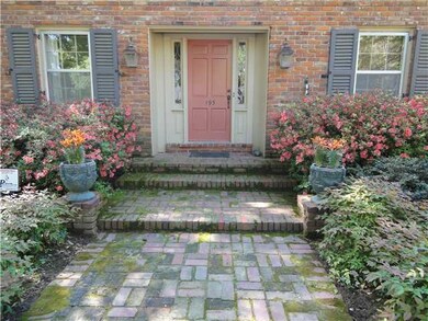 Charming entry area with colorful azaleas and deli