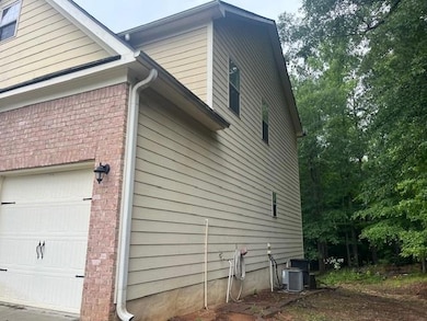 View of side of home with brick siding