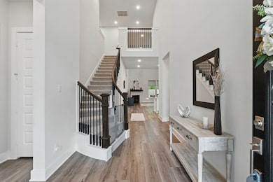 The entryway speaks sophistication with soaring ce