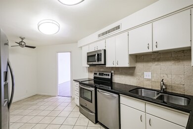 Another view of kitchen looking toward breakfast a