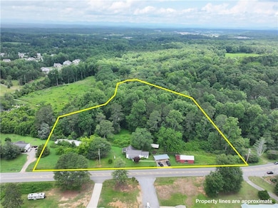 Aerial overview of property's location featuring property parcel outlined