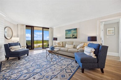 Living room with hardwood / wood-style flooring, a