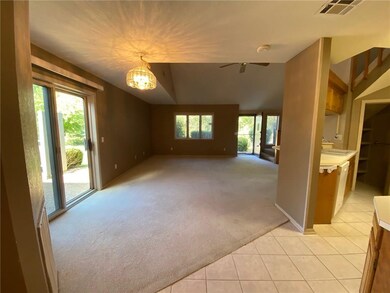 Dining opens to private patio and kitchen and living room