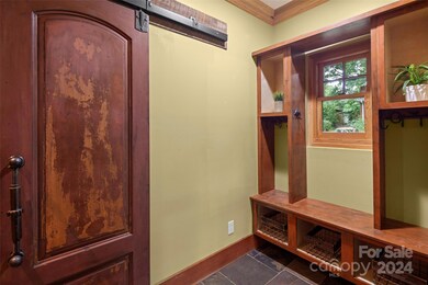 Mudroom nook at main entrance with storage.