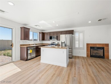 Kitchen with stainless steel appliances, a sink, b