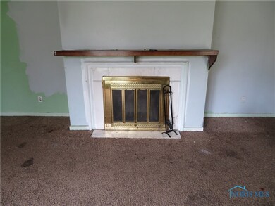Wood burning fireplace is the focal point for larg