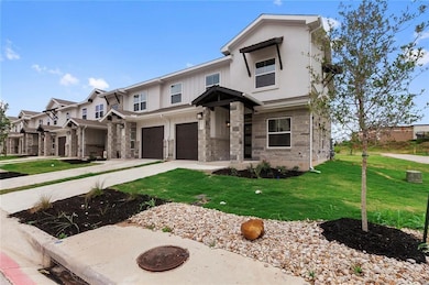 View of front of home featuring an attached garag