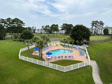 View of swimming pool featuring a patio area and a