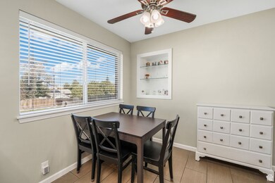 Dining space featuring baseboards and light wood-style floors