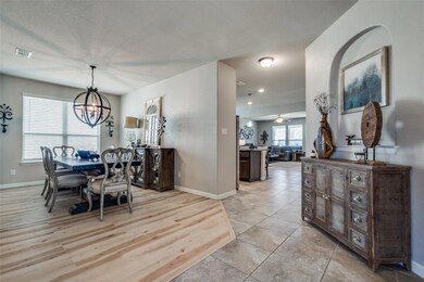 Dining room featuring ceiling fan with notable cha