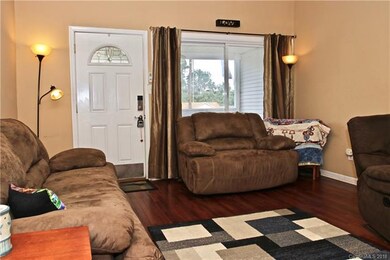 Large picture window overlooks front, covered porc