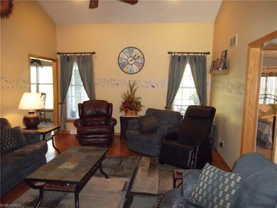 Beautiful vaulted ceiling and hardwood floor in li