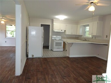 Large eat-in kitchen with access to a full-size la