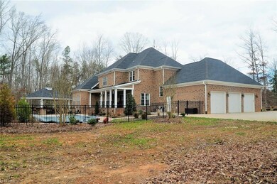 Side view to rear view of house.....fenced in with In-Ground Pool, Outdoor living space