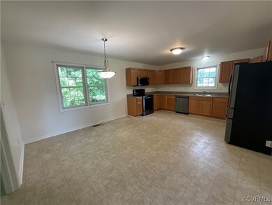 Large Kitchen with room for island and hanging light fixtures