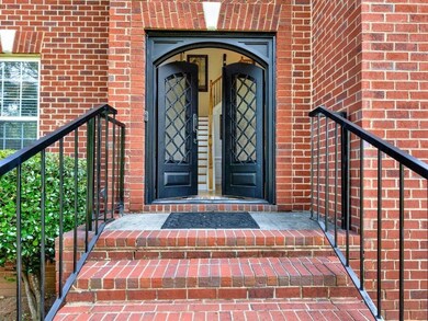 Doorway to property with brick siding