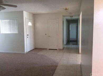 ENTRANCE WITH NEW CARPET THOUGH OUT THE HOME
