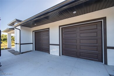 Garage with concrete driveway