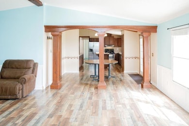 Kitchen with arched walkways, stainless steel appl