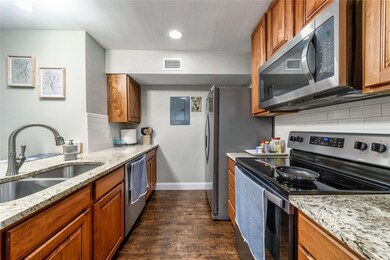 Kitchen featuring stainless steel appliances, ligh