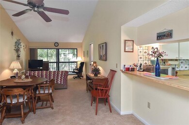 Kitchen, dining room, living room with sliders to 