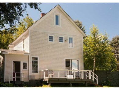 Exterior Back. Relaxing deck to...