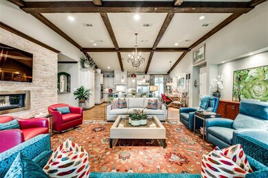 Beamed ceiling, glass fireplace, and open concept 