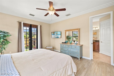 Bedroom with multiple windows, access to exterior,