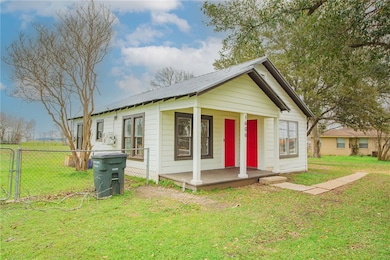 Bungalow-style house featuring a front yard, fence