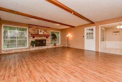 Massive den with picture windows. This space featu