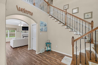 Warm and inviting entryway flows seamlessly into t