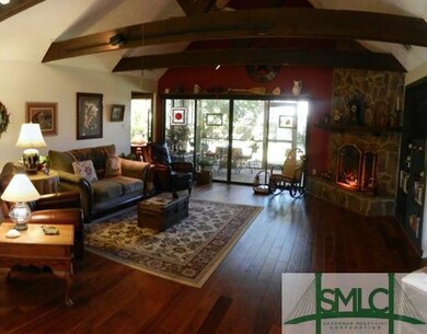 Living Room. Open, with beamed ceilings, hardwoods