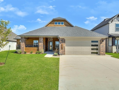 View of front of home with brick siding, concrete 