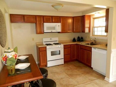 Kitchen. New ceramic tile flooring, cabinets, and 
