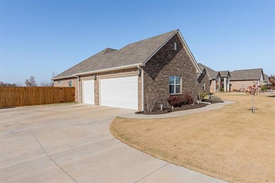 View of side of home with a garage