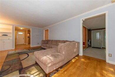 The Living Room showing access to the Family Room at right