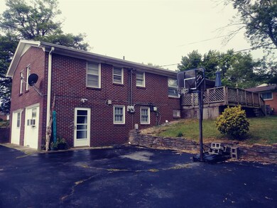 Spacious driveway and room for backyard entertainment.
