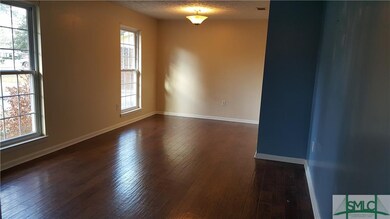 Living Room/Dining Room combo with hardwood floor