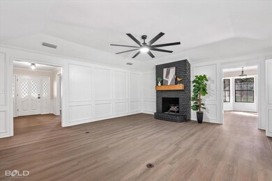 Unfurnished living room with wood-type flooring, c