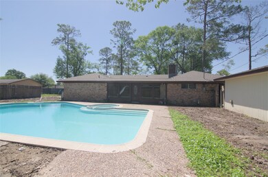 Poolside overlooking the large windows by the fami