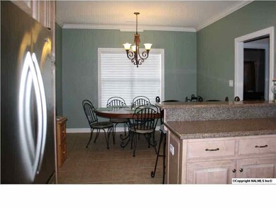 Kitchen opens nicely to the large breakfast room. Overlooking the pool and decking is an added plus!