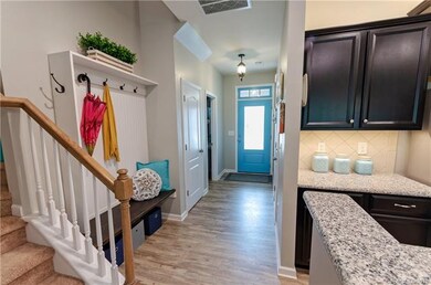 Beautiful oyer with upgraded foyer light.