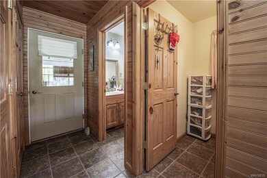 Front Right Side Door view. Laundry room, 1/2 bath