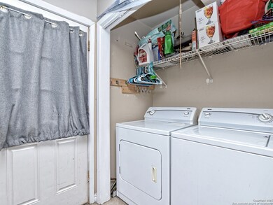 Laundry nook inside kitchen by side entrance
