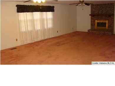 THE GREAT ROOM IS ACCENTED WITH A FIREPLACE AND PL