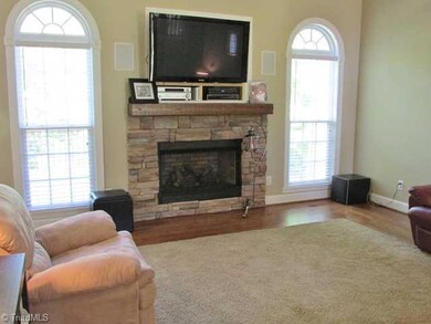 Den/Family/Great Room. Rock Fireplace - Inlaid carpet on hardwoods